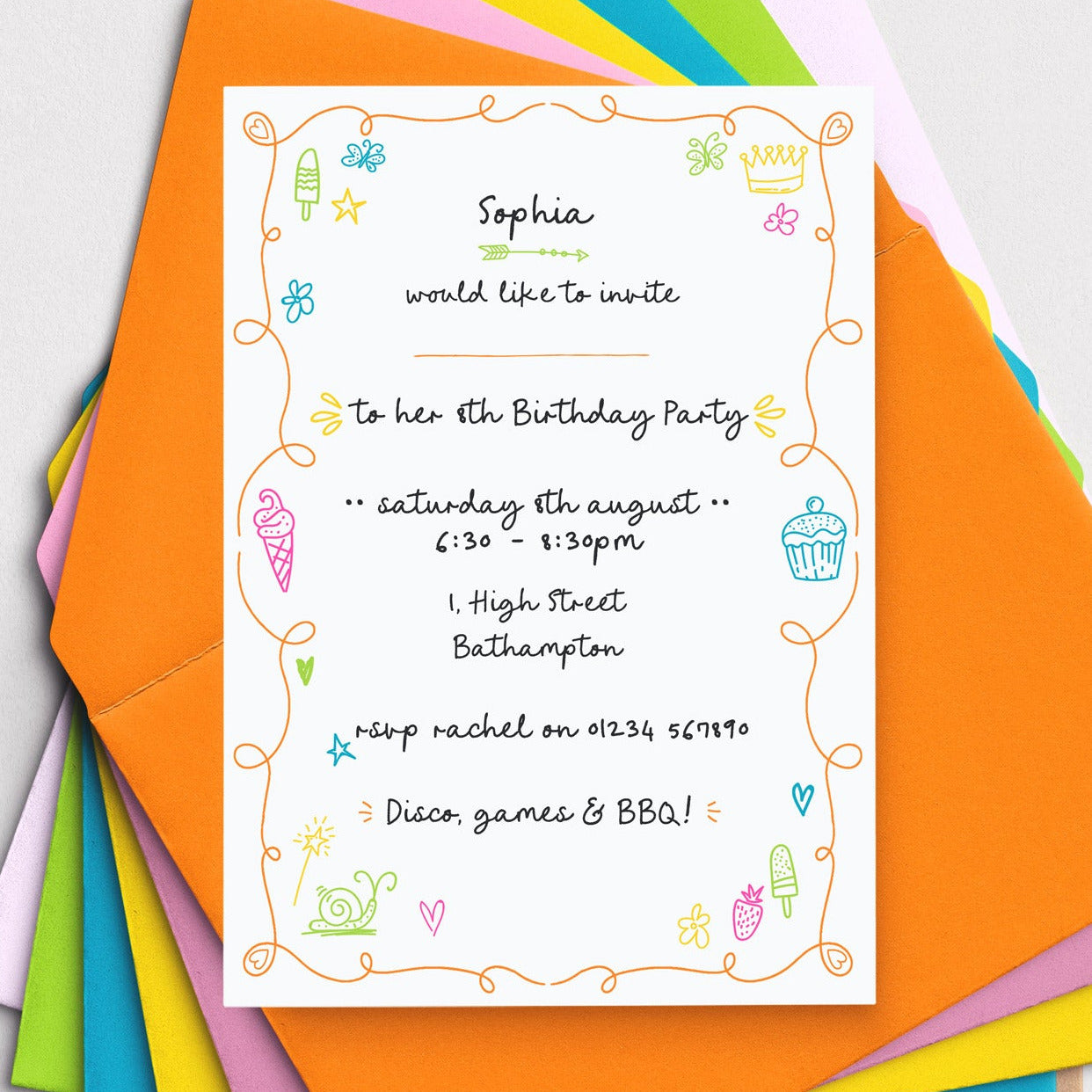 Birthday party invitation with colorful border on a stack of multicolored envelopes.