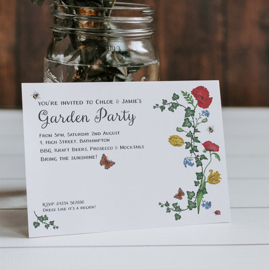 A floral invitation card with a clear window displaying a butterfly, a sunflower, and other flowers. The card has text for a garden party and includes a green and white color scheme.