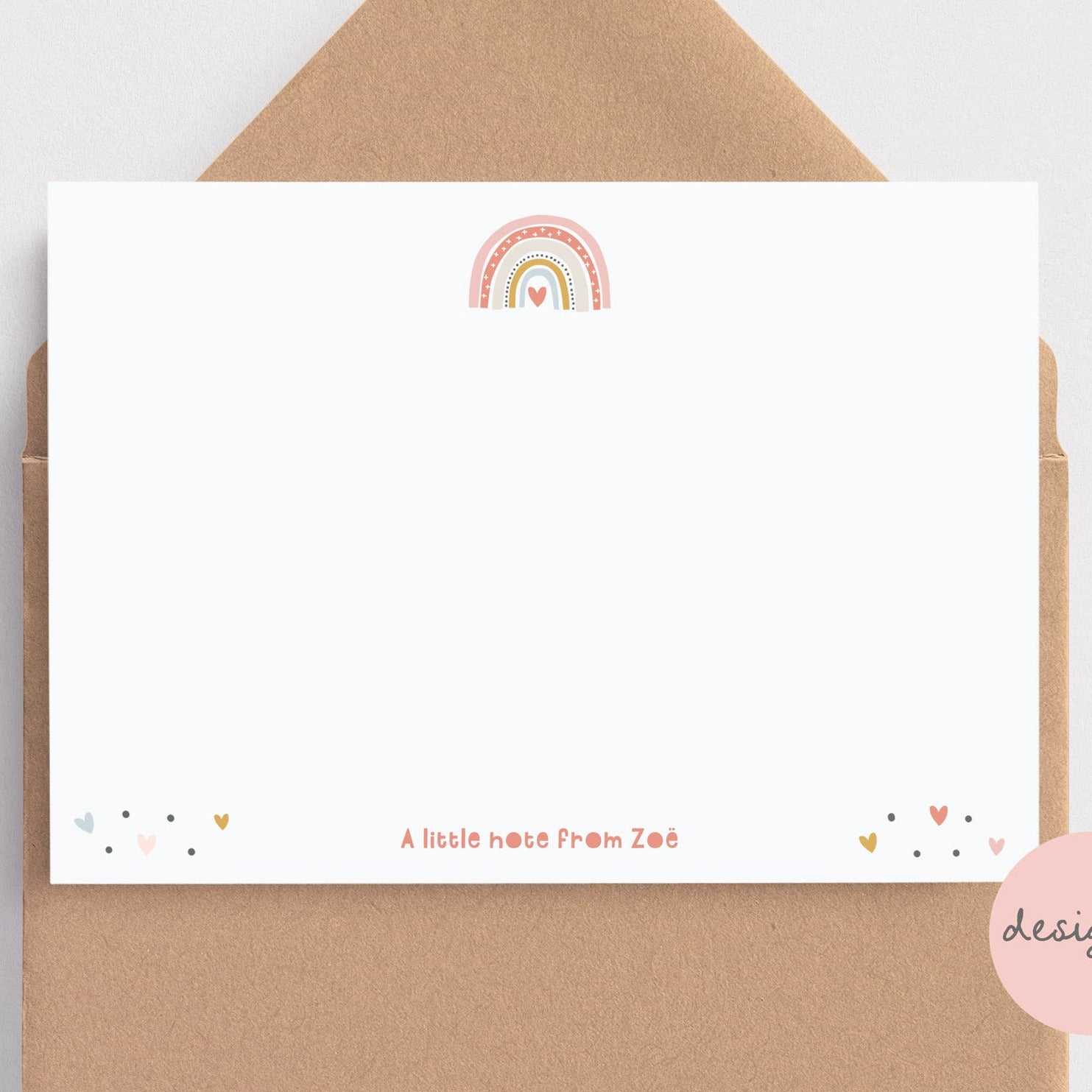 Note card with rainbow design on a brown envelope